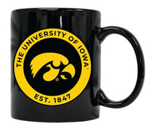 Load image into Gallery viewer, Iowa Hawkeyes 12 oz Black Ceramic Coffee Mug Circle Design Officially Licensed Collegiate Product 
